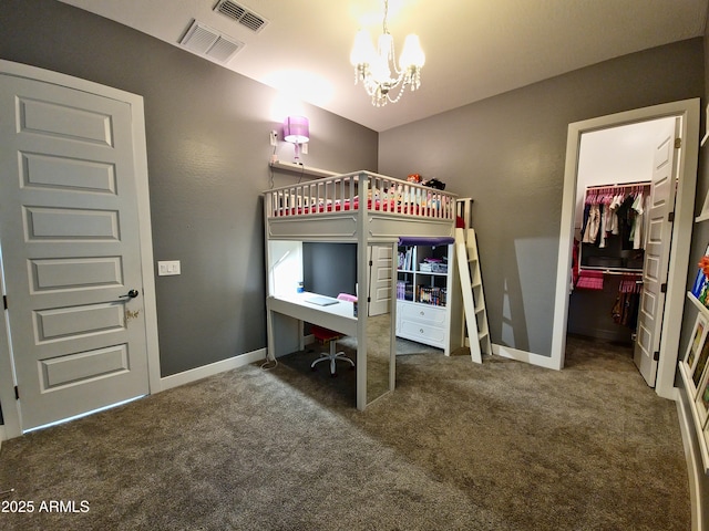 9187 W Parkside Ln, Peoria, AZ 85383 - carpeted bedroom featuring a chandelier, a walk in closet, a desk, baseboards, and a closet