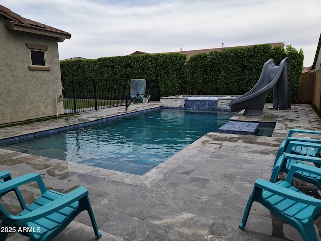 9187 W Parkside Ln, Peoria, AZ 85383 - view of pool featuring a water slide, a fenced backyard, a patio, and an in-ground hot tub