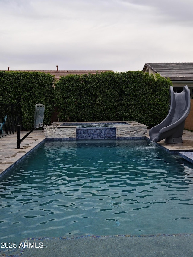 9187 W Parkside Ln, Peoria, AZ 85383 - view of pool featuring a water slide and a fenced backyard