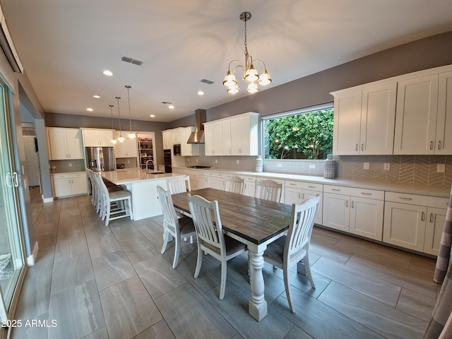 9187 W Parkside Ln, Peoria, AZ 85383 - dining space featuring a chandelier and recessed lighting