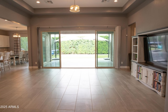 9187 W Parkside Ln, Peoria, AZ 85383 - unfurnished living room featuring a chandelier, baseboards, and recessed lighting