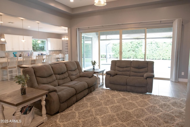 9187 W Parkside Ln, Peoria, AZ 85383 - living room featuring light tile patterned flooring and recessed lighting