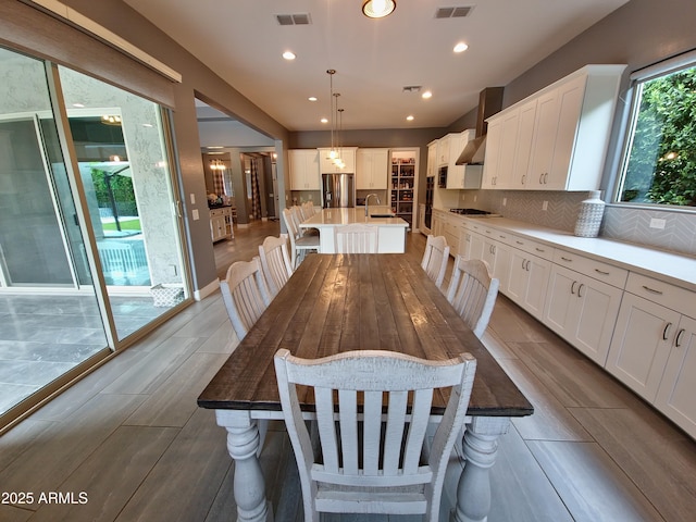 9187 W Parkside Ln, Peoria, AZ 85383 - dining room featuring recessed lighting and wood finished floors