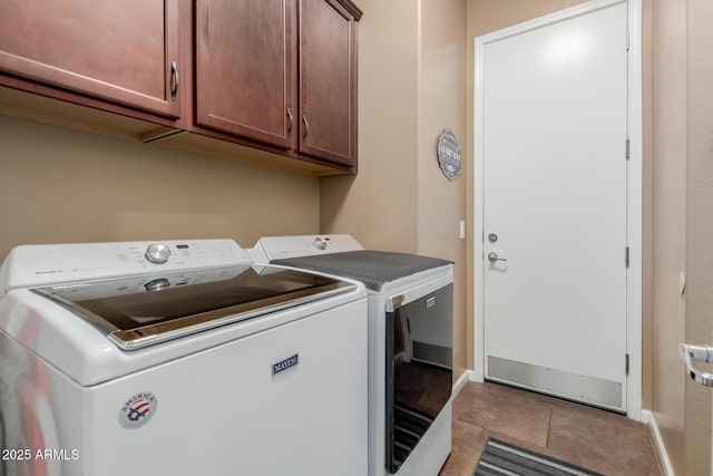20556 W Point Ridge Rd, Buckeye, AZ 85396 - washroom with washing machine and clothes dryer, cabinet space, tile patterned flooring, and baseboards