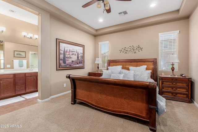 20556 W Point Ridge Rd, Buckeye, AZ 85396 - bedroom featuring light carpet, connected bathroom, baseboards, ceiling fan, and recessed lighting
