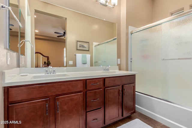 20556 W Point Ridge Rd, Buckeye, AZ 85396 - bathroom with double vanity, tile patterned floors, ceiling fan, and combined bath / shower with glass door