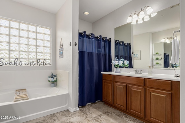 full bath with a bath and vanity