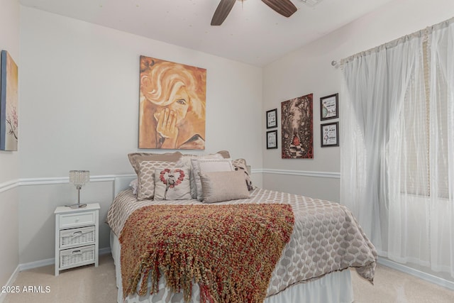 bedroom with carpet floors, baseboards, and ceiling fan