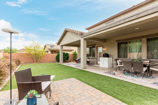 exterior space with a fenced backyard and outdoor dining space