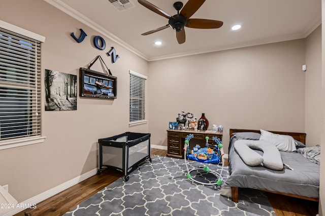 bedroom featuring visible vents, ornamental molding, wood finished floors, recessed lighting, and baseboards