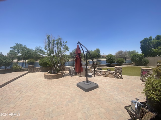 view of jungle gym featuring a patio area and fence