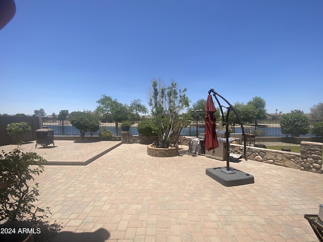 view of patio / terrace featuring fence