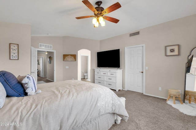 carpeted bedroom featuring ensuite bath, ceiling fan, and lofted ceiling