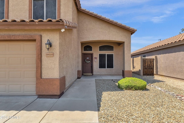 property entrance featuring a garage