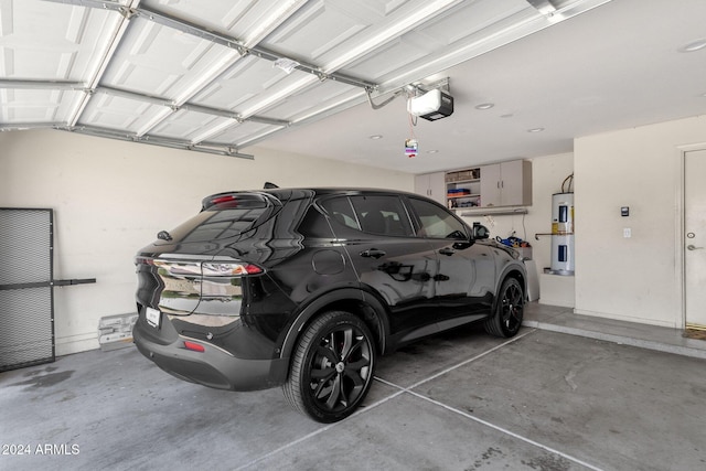 garage with a garage door opener and water heater