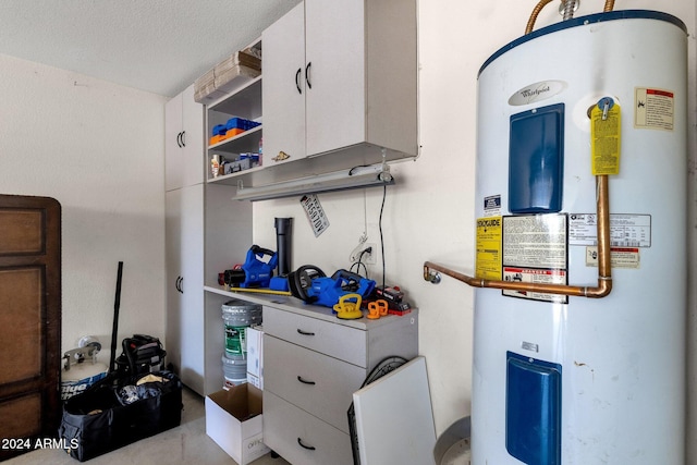 utility room featuring water heater