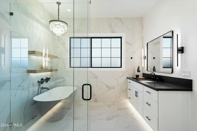 bathroom featuring a chandelier, marble finish floor, a marble finish shower, and vanity