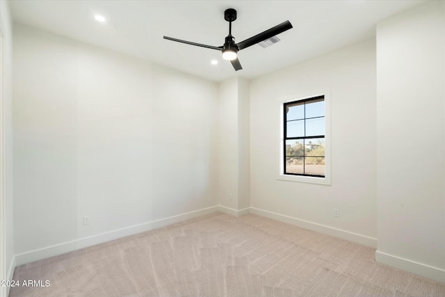 carpeted empty room with visible vents, baseboards, a ceiling fan, and recessed lighting