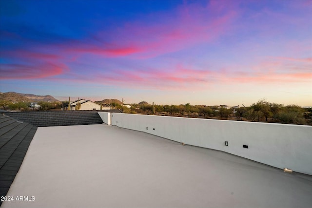 patio terrace at dusk with a mountain view