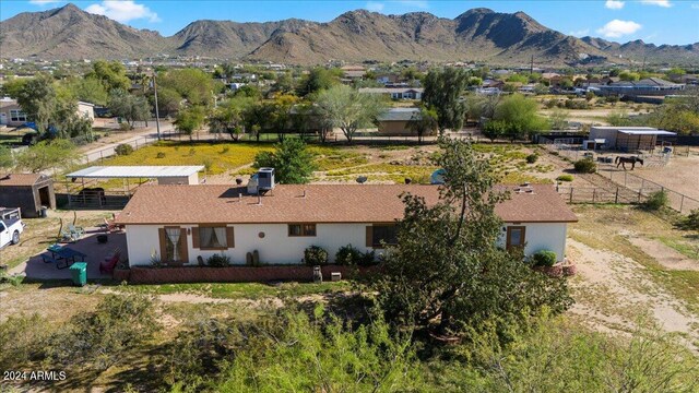 birds eye view of property featuring a mountain view