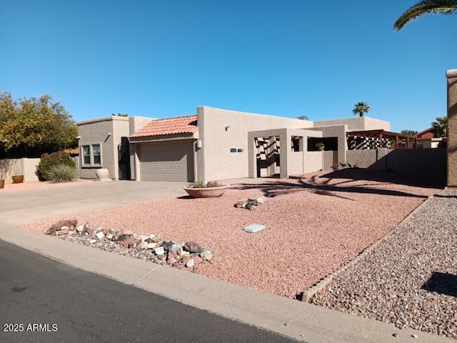 adobe home featuring a garage