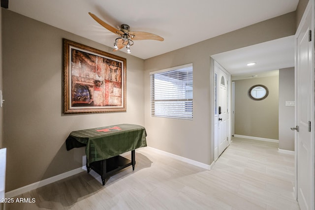 interior space featuring ceiling fan