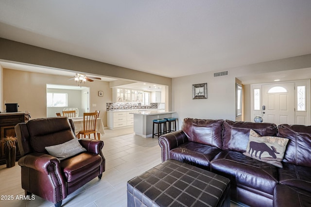 living room with ceiling fan