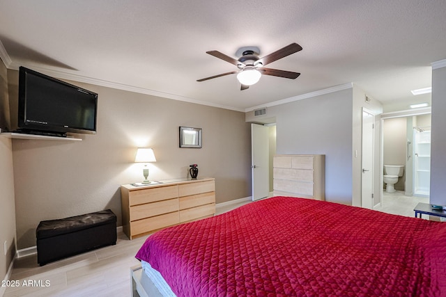 bedroom with ceiling fan, ornamental molding, and ensuite bath