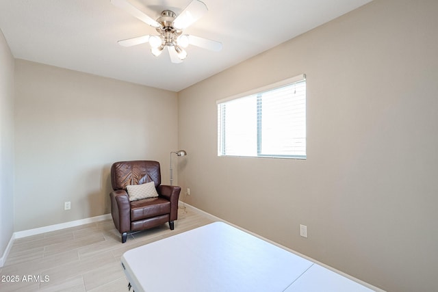 living area with ceiling fan