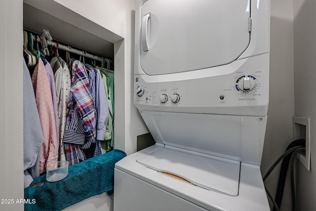 washroom with stacked washer and clothes dryer