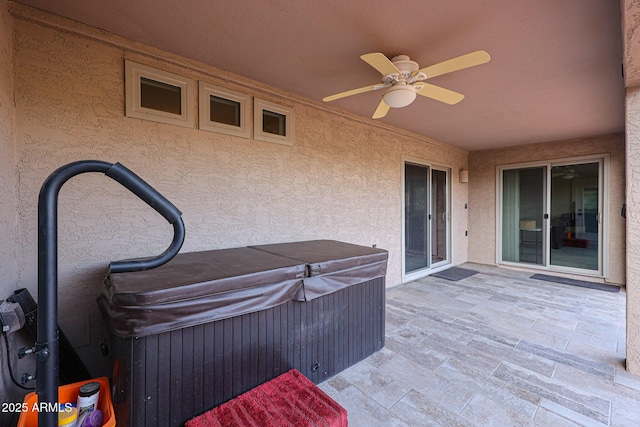 exterior space with ceiling fan