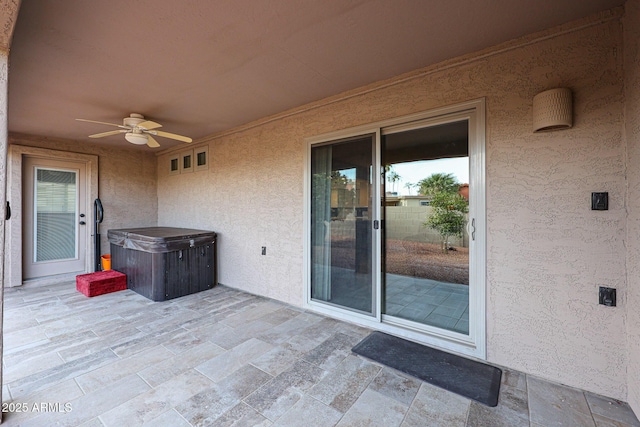 view of patio featuring ceiling fan