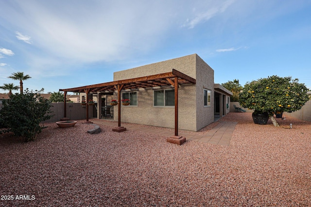 back of house with a patio