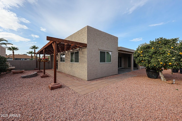 view of side of property with a patio area