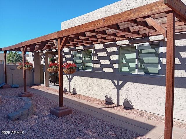 exterior space featuring a pergola