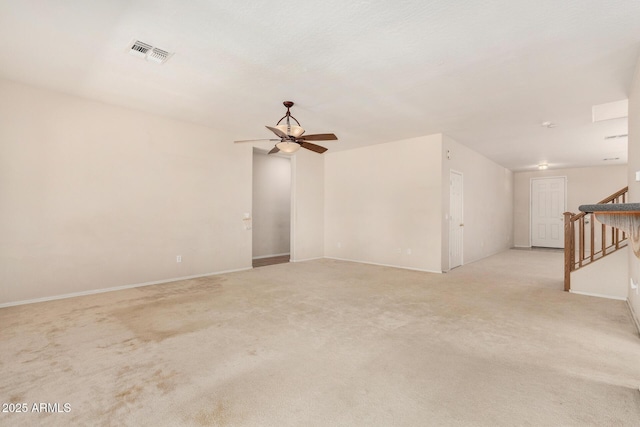 11511 E Renata Ave, Mesa, AZ 85212 - spare room featuring a ceiling fan, stairway, light colored carpet, and baseboards
