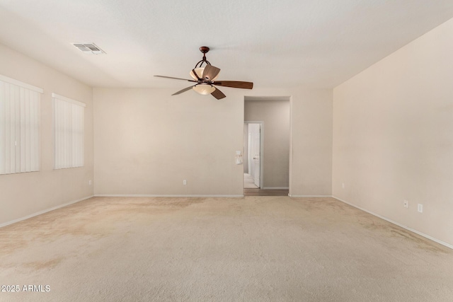 11511 E Renata Ave, Mesa, AZ 85212 - spare room featuring ceiling fan, light colored carpet, and baseboards