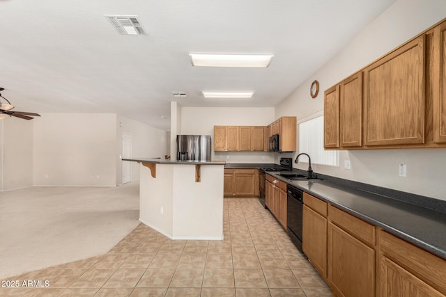 11511 E Renata Ave, Mesa, AZ 85212 - kitchen featuring black appliances, a sink, a kitchen breakfast bar, and dark countertops