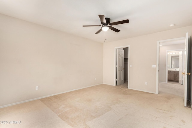 11511 E Renata Ave, Mesa, AZ 85212 - unfurnished bedroom featuring light carpet, baseboards, and a ceiling fan