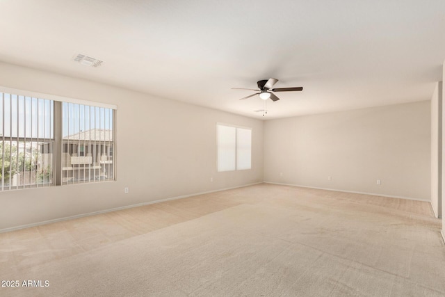 11511 E Renata Ave, Mesa, AZ 85212 - unfurnished room featuring a ceiling fan, light carpet, and baseboards