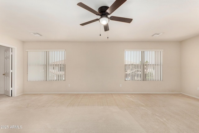 11511 E Renata Ave, Mesa, AZ 85212 - unfurnished room featuring light colored carpet, a ceiling fan, and baseboards