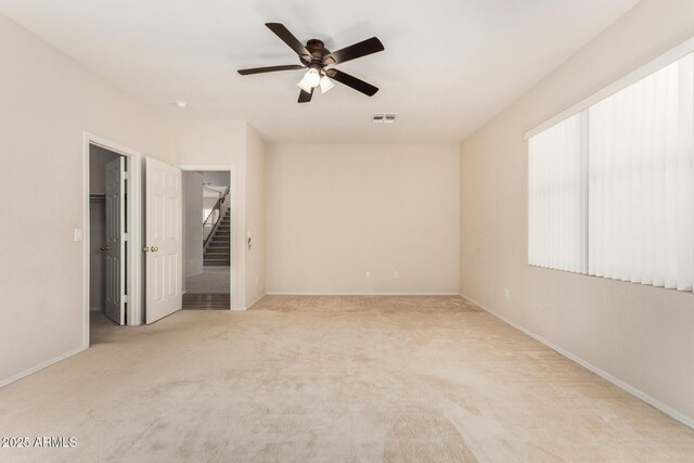 11511 E Renata Ave, Mesa, AZ 85212 - carpeted spare room featuring a ceiling fan, baseboards, and stairs