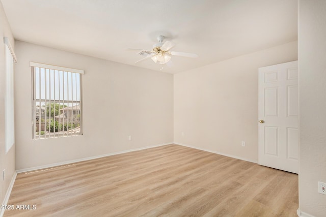 11511 E Renata Ave, Mesa, AZ 85212 - spare room featuring light wood-style flooring, a ceiling fan, and baseboards