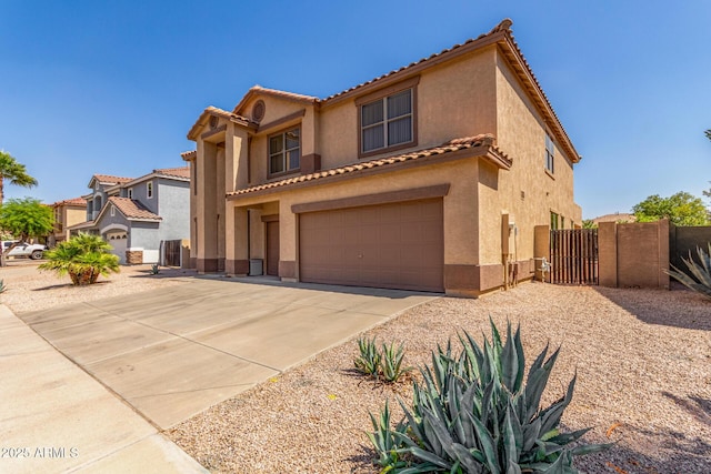 11511 E Renata Ave, Mesa, AZ 85212 - mediterranean / spanish-style home with an attached garage, stucco siding, driveway, a tiled roof, and a gate