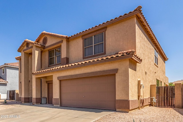 11511 E Renata Ave, Mesa, AZ 85212 - mediterranean / spanish house with a tile roof, an attached garage, and stucco siding
