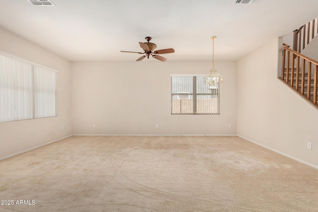11511 E Renata Ave, Mesa, AZ 85212 - carpeted empty room featuring stairs, ceiling fan, a chandelier, and baseboards