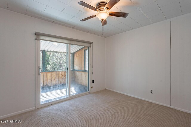 carpeted bedroom featuring ceiling fan and crown molding