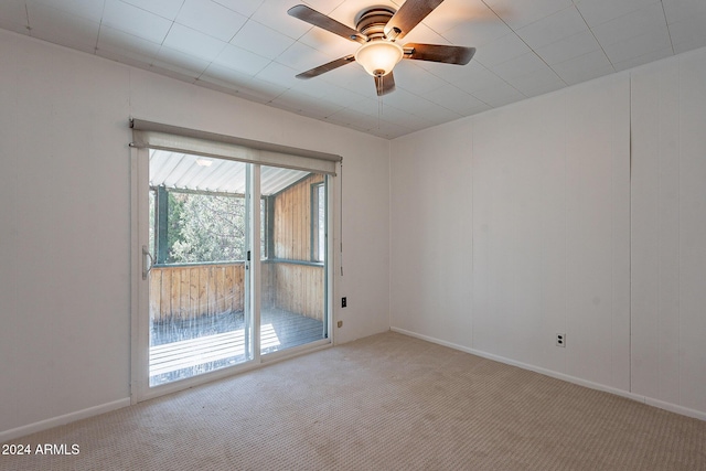 empty room with light carpet, ceiling fan, and baseboards