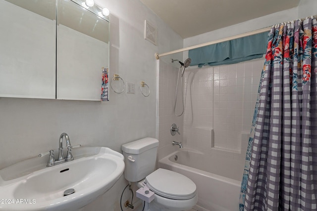 full bathroom with toilet, shower / tub combo, visible vents, and a sink