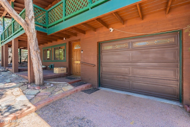 doorway to property featuring a garage